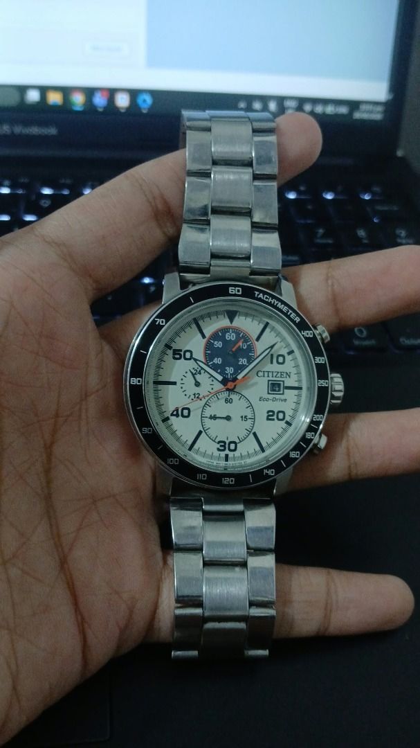 Citizen Eco-Drive Chronograph Watch (Category: Men's Watches) located in Quezon City. Submitted by johnlimboy (Listing ID 1465377935, Image 1). Description: - Brand: Citizen Eco-Drive Chronograph Watch - Dial/Bezel: Cream dial paired with a striking black tachymeter bezel - Power: Eco-Drive technology (powered by any light, never needs a battery) - Features: Three sub-dials and a convenient date window at the 4 o'clock position - Water Resistance