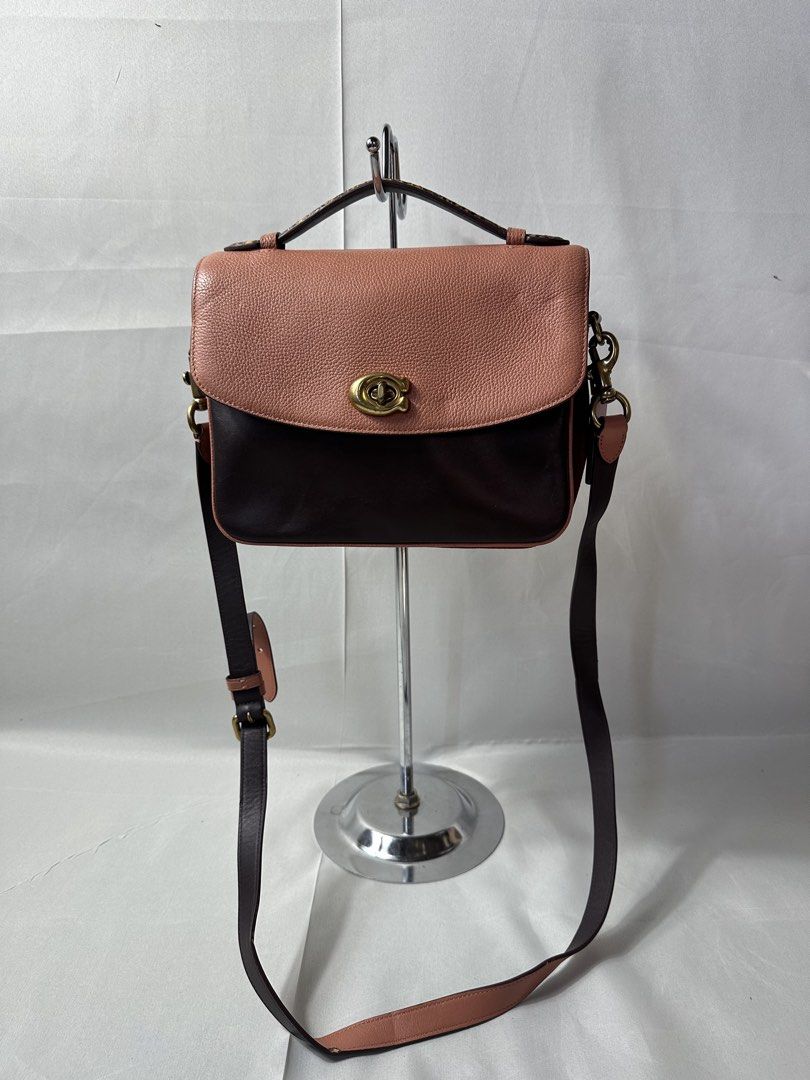Coach Cassie Crossbody Leather Bag (Category: Babies & Kids Fashion) located in Cabanglasan. Submitted by thefashiongarage.co (Listing ID 1465241180, Image 2). Description: Title - Coach Model/Name - Cassie Size on Tag - Small Conditiion - Excellent Condition with minimal sign of wear - Press mark on rubber lining sa may Strap - Scratches on the suade Dimension (WxLxH) - Category- Crossbody Bag/Handbag Fitting - Made in - China Material - Leather