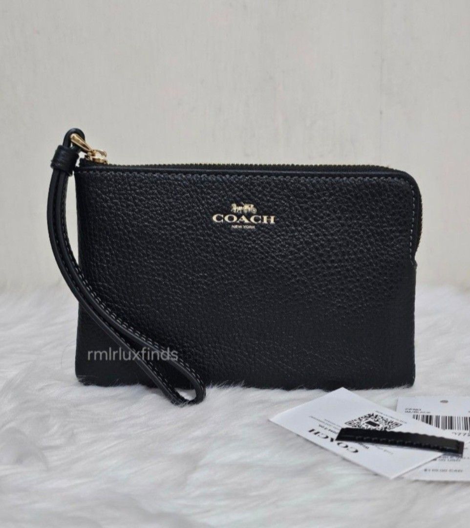 Coach Corner SIngle Zip Black Pebbled Leather Wristlet🇺🇲Authentic (Category: Luxury Bags & Wallets) located in Quezon City. Submitted by rmlrluxfinds (Listing ID 1413866484, Image 3). Description: ** brandnew, sealed and authentic ** measures 6.25"L x 4"H x 0.5"W ** refined pebble leather ** fabric lining ** wrist strap attached ** 2 credit card slots ** zip-top closure ON HAND and ready to ahip ✅️tag ✅️carecard rmlrluxfinds is not associated o