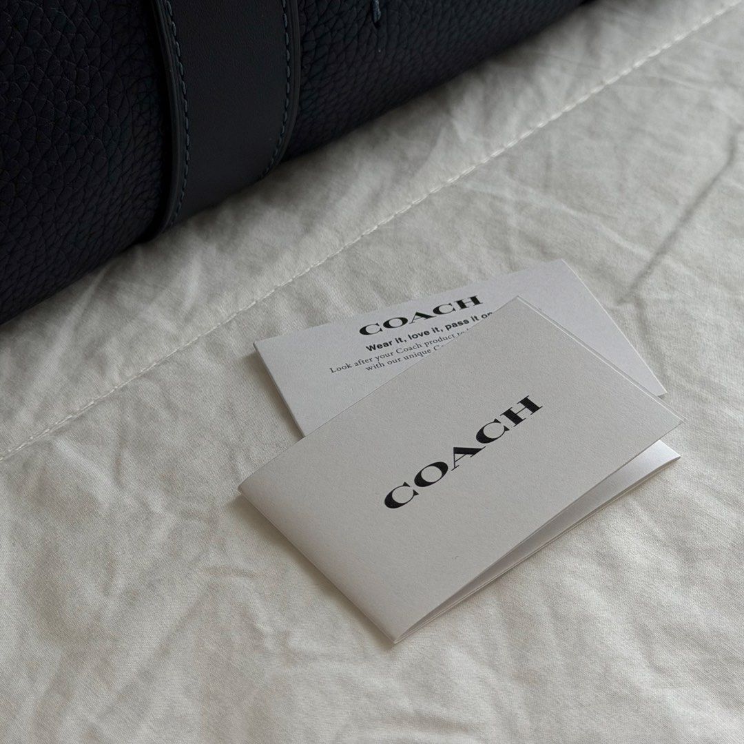 Coach Gotham Portfolio Bag (Style #C5318) (Category: Briefcases) located in Mabalacat. Submitted by philscabinet (Listing ID 1465255793, Image 2). Description: Coach Gotham Portfolio Bag (Style #C5318) - Color: Dark Blue/Navy - 100% Authentic Coach Bag - Dimensions: 15” (L) x 11.75” (H) x 4” (W) - Material: Polished pebble leather and refined calf leather - Laptop Compatibility: Fits up to a 15-inch laptop - Lightly Used (Can send more photos for