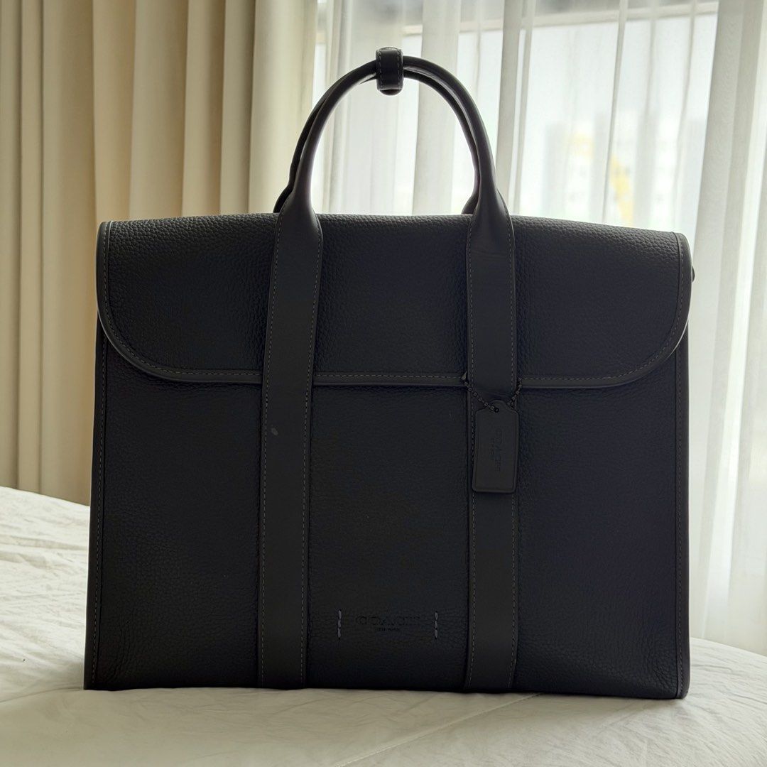 Coach Gotham Portfolio Bag (Style #C5318) (Category: Briefcases) located in Mabalacat. Submitted by philscabinet (Listing ID 1465255793, Image 1). Description: Coach Gotham Portfolio Bag (Style #C5318) - Color: Dark Blue/Navy - 100% Authentic Coach Bag - Dimensions: 15” (L) x 11.75” (H) x 4” (W) - Material: Polished pebble leather and refined calf leather - Laptop Compatibility: Fits up to a 15-inch laptop - Lightly Used (Can send more photos for