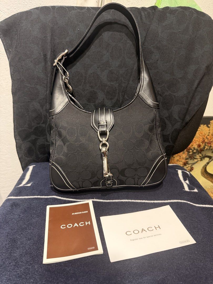 Coach Hampton Black Monogram Shoulder Bag (Category: Luxury Bags & Wallets) located in Taguig. Submitted by xylasprelovedbag (Listing ID 1465313258, Image 1). Description: - Brand: Coach - Style: Signature monogram shoulder bag - Color: Black fabric with black leather trim and white contrast stitching - Hardware: Silver-tone - Closure: Distinctive front dog leash clip - Strap: Adjustable with buckle hardware - Pockets: Convenient exterior slip po