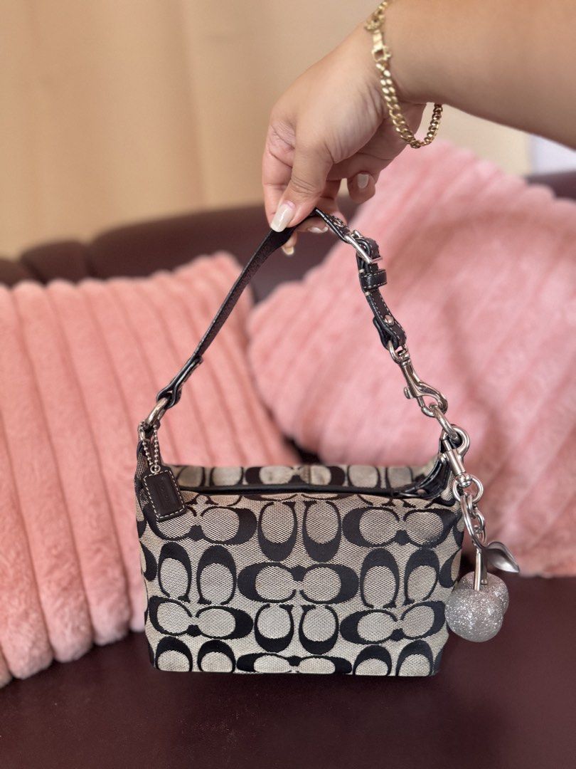 Coach Mini Hobo Bag (Category: Belt bags, Clutches and Pouches) located in San Francisco. Submitted by shopluckyfindsbydk (Listing ID 1465296234, Image 1). Description: - Well-used - 100% authentic - clean hardwares - rubber lining intact but may crackings na esp under straps - has dirts and rubs, see slides 9 to 17 for reference - needs cleaning - has hangtag 🌸 All items are preloved. Please manage your expectations. REVIEW ALL PHOTOS before pu