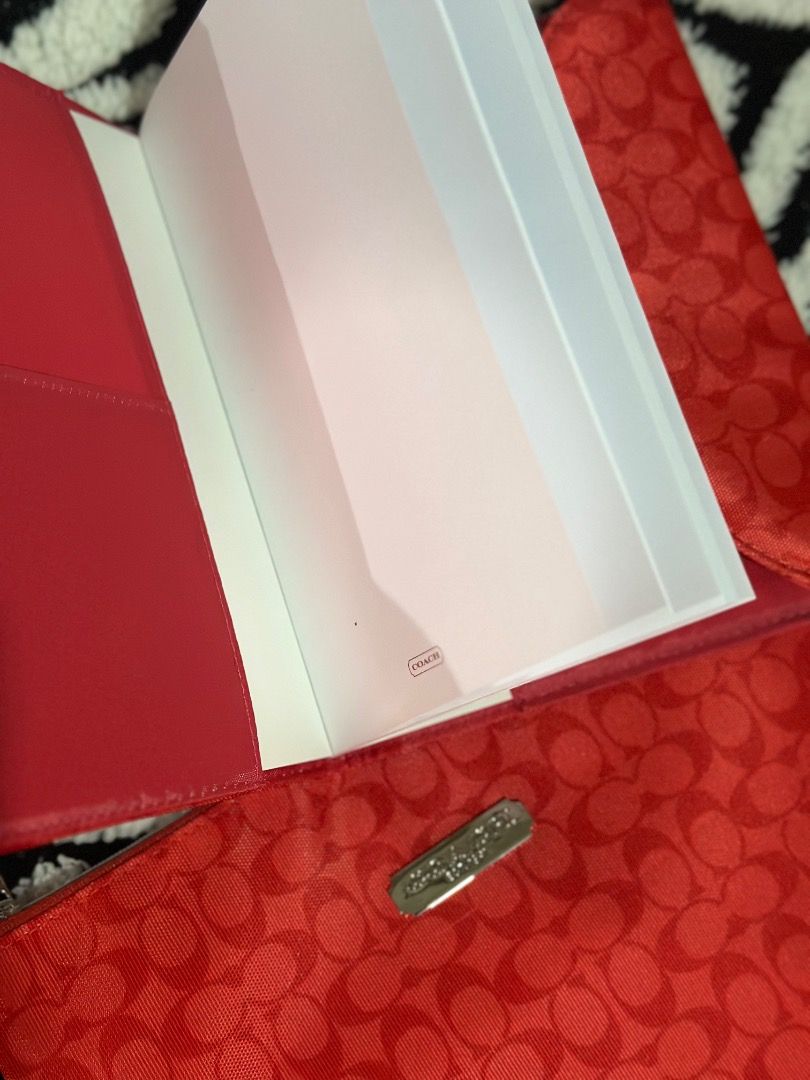 Coach Red Signature C Planner Cover with Notepad (Category: Stationery & School Supplies) located in Cebu City. Submitted by isellhere123.543 (Listing ID 1465296977, Image 3). Description: - Authentic Coach planner cover in red signature C fabric - Vibrant red interior lining with convenient card slots - Includes an official Coach-branded notepad - Features secure snap closure and sleek silver-tone hardware - Comes with a matching zip pouch for e