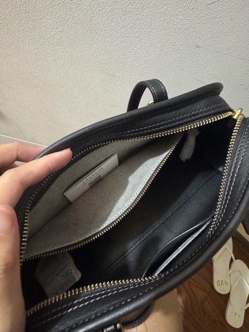 Coach Swing Zip Shoulder Bag Black Leather (Category: Luxury Bags & Wallets) located in Cagayan de Oro. Submitted by jajairiv (Listing ID 1456497494, Image 3). Description: - Coach Swing Zip shoulder bag - Color: Black - Material: Leather - Size: Small - Closure: Zip - Compartment: Main compartment - Origin: Made in the Philippines - Original Retail Price: $395 USD - Note: Bag charm shown in photos is not included..