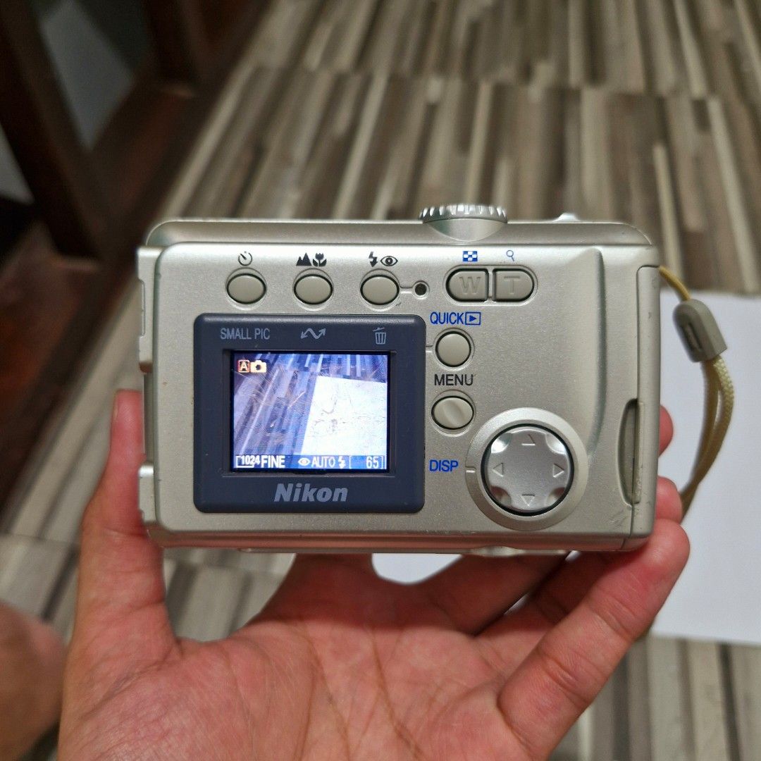 (COD AVAILABLE!!!) Nikon Coolpix 2000 Digicam (Category: Cameras) located in Caloocan City. Submitted by konan_11359 (Listing ID 1465339002, Image 3). Description: (COD AVAILABLE!!!) Nikon Coolpix 2000 Digicam WHY CHOOSE THIS: ♡ Malakas na Flash ♡ Malinaw na output ♡ Many modes to play with. ♡ Matagal malowbat (depends sa batt) ♡ Smooth control and picture ♡ Slim and Compact ♡ Vintage Video from cam ♡ Vintage cam feel Condition: Used! All buttons
