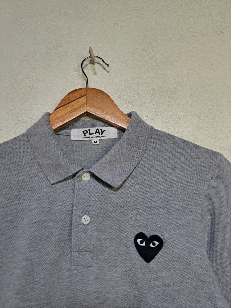 Comme Des Garcons PLAY Polo Shirt (Category: Shirts) located in Dumaguete. Submitted by jayarbajad49160 (Listing ID 1465318749, Image 2). Description: Comme Des Garcons PLAY Polo Shirt - 600 add sf Excellent Condition Color rate:9.8/10 No issue Size Medium Width:17 Length:22 Loc dumaguete city visayas.