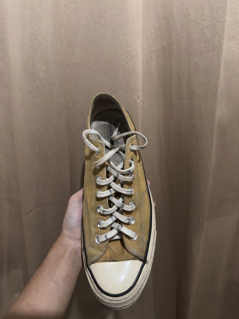 Converse Chuck 70 Low Top Sunflower Yellow (Category: Sneakers) located in Quezon City. Submitted by bebe0827 (Listing ID 1465300665, Image 1). Description: - Brand: Converse - Model: Chuck 70 Low Top - Color: Sunflower Yellow - Features: Classic rubber toe cap, foxing tape, metal eyelets, includes white laces - Condition: Pre-owned with visible signs of wear and dirt marks along the midsole and upper canvas - Perfect for daily casual wear.
