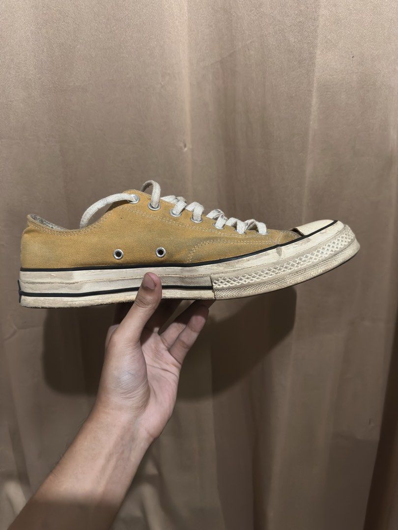 Converse Chuck 70 Low Top Sunflower Yellow (Category: Sneakers) located in Quezon City. Submitted by bebe0827 (Listing ID 1465300665, Image 3). Description: - Brand: Converse - Model: Chuck 70 Low Top - Color: Sunflower Yellow - Features: Classic rubber toe cap, foxing tape, metal eyelets, includes white laces - Condition: Pre-owned with visible signs of wear and dirt marks along the midsole and upper canvas - Perfect for daily casual wear.