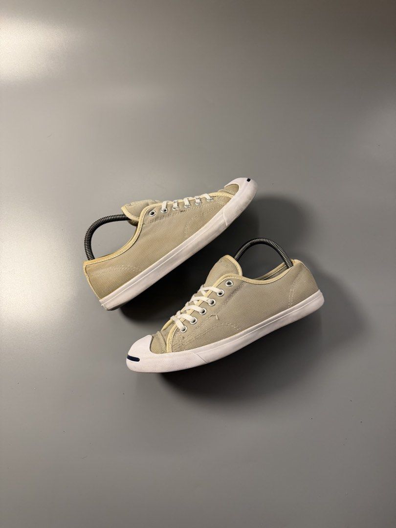 Converse Jack Purcell Canvas Sneakers (Category: Sneakers) located in Caloocan City. Submitted by maempenafi21452 (Listing ID 1465281363, Image 1). Description: - Brand: Converse Jack Purcell - Style: Low-top sneakers - Color: Beige canvas with white midsoles - Iconic Details: Navy smiley line on toe cap, red and black heel plates - Condition: Minor yellowing near edges and heel seams; outsoles show normal wear from previous use - Inclusion: Free