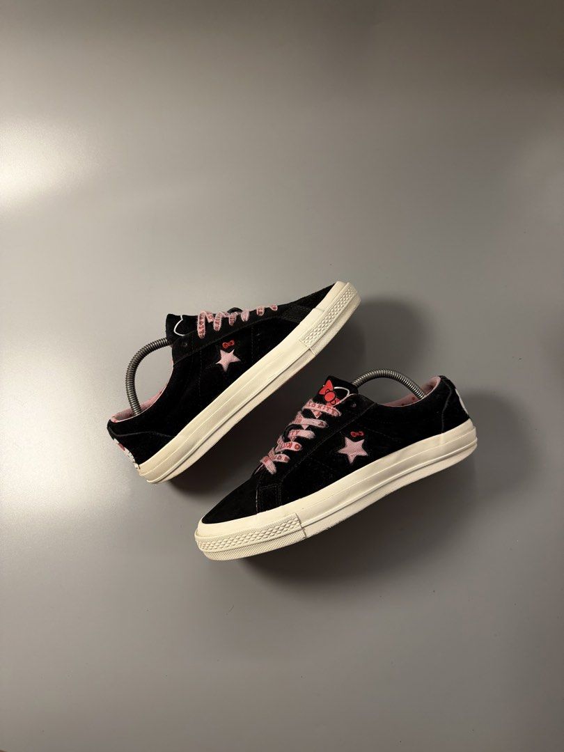Converse x Hello Kitty One Star Black (Category: Sneakers) located in Caloocan City. Submitted by maempenafi21452 (Listing ID 1465282015, Image 1). Description: - Model: Collaborative Black Suede Sneakers - Size: Mens 7.5 / Womens 9.5 - Design: Pink star cutout with Kitty bow & heel graphic - Interior: Cute pink polka dot inner lining - Extras: Custom patterned laces included - Sole: Classic red outsole with standard Converse branding.