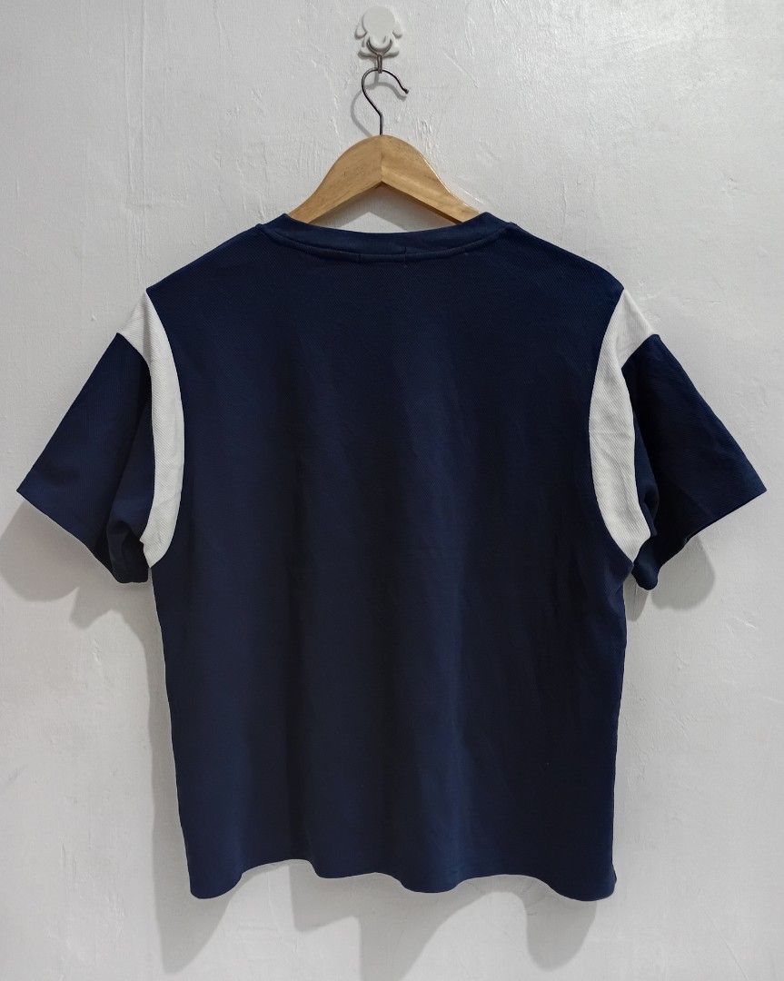 COURRÈGES patch logo boxy fit Shirt (Category: Shirts) located in Navotas City. Submitted by ms.soulana (Listing ID 1465250136, Image 2). Description: PreOwned LikeNew Lightly Used Courreges patch logo boxy fit Shirt - Color: Navy blue with contrasting white side panels on shoulders and sleeves - Details: Embroidered logo patch on left chest, classic crew neckline - Fit: Short sleeves, clean and versatile design - Size LARGE -XL Boxy fit OverSize