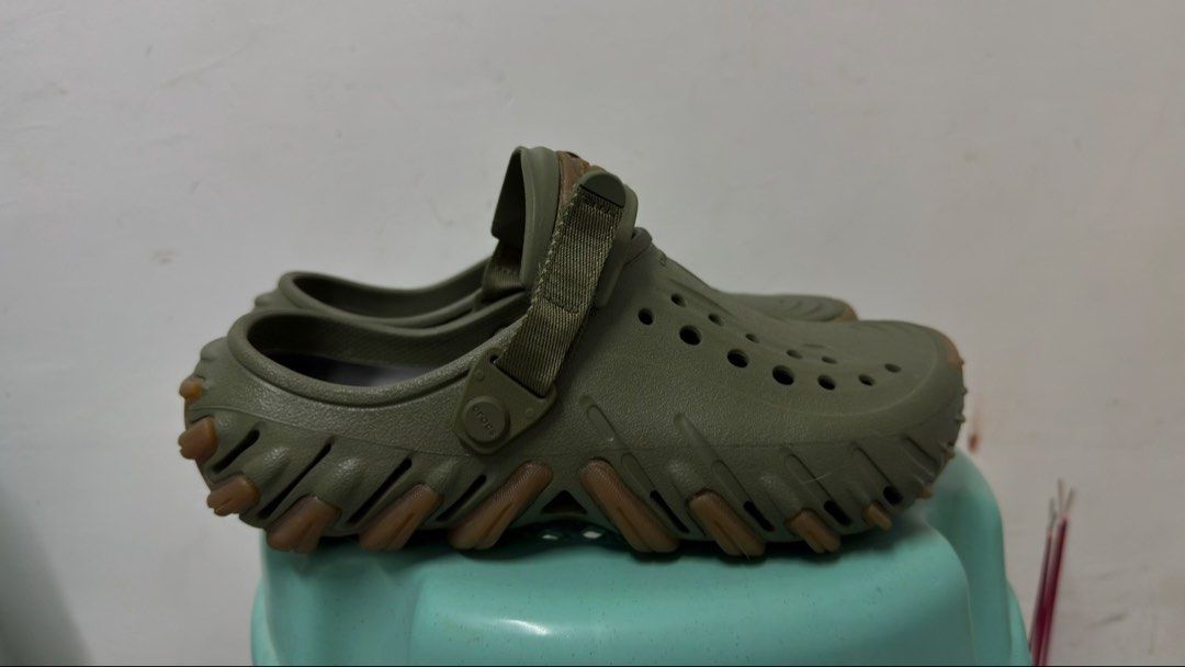 Crocs Echo Clog Army Green M7W9 (Category: Slippers & Slides) located in Pasig City. Submitted by llrapadas57381 (Listing ID 1465181118, Image 2). Description: - Item: Crocs Echo Clog - Color: Army Green - Size: Men US 9 - Condition: Brand new, used twice - Authenticity: Purchased from Sports Central (original receipt in photos) - Features: Bold molded design, adjustable strap, and rugged tread pattern - RFS: size Too big.