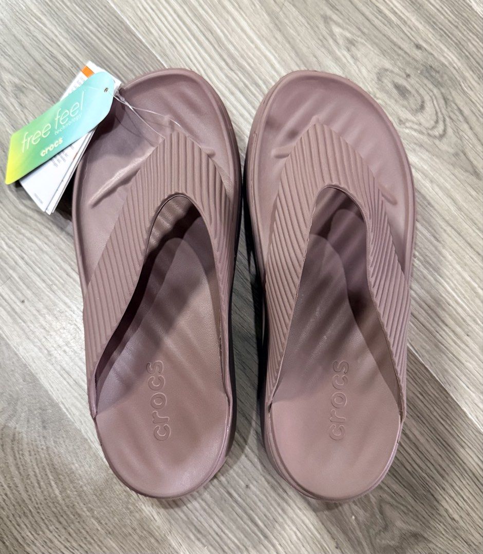 Crocs Free Feel Technology Thong Sandals Dusty Rose (Category: Slippers and slides) located in Dasmarinas. Submitted by toyang50 (Listing ID 1465178351, Image 1). Description: Crocs thong sandals in dusty rose. Features Free Feel technology with soft textured straps. Cushioned sole with debossed Crocs logo on the footbed. Original product tags attached. Slip-on design, lightweight construction. Unworn condition, tags still on..