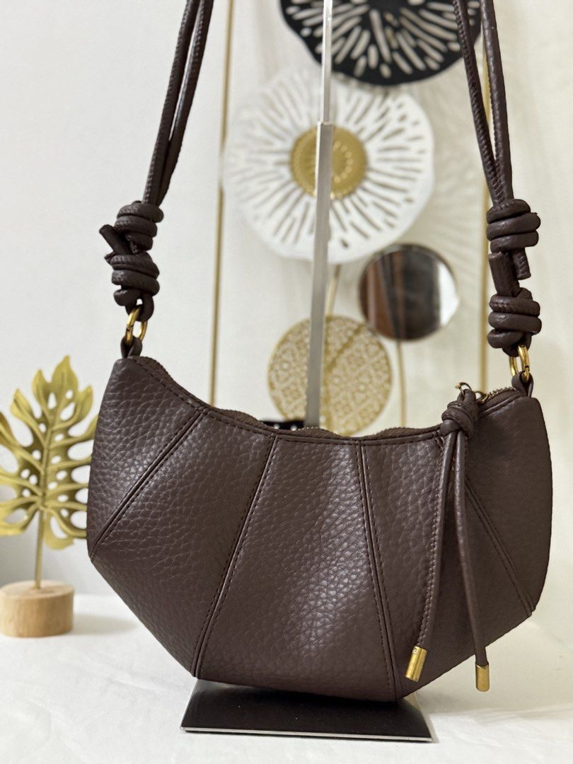 Croissant Convertible Bag (Category: Cross-body Bags) located in Cainta. Submitted by angellyy_ (Listing ID 1465282279, Image 2). Description: Korean Brand Croissant Bag Color: Choco brown Strap is Convertible to sling and shoulder bag Condition 10/10 Size - small Can fit up to slim medium wsllett.
