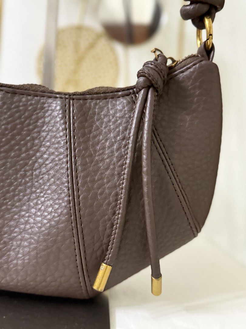 Croissant Convertible Bag (Category: Cross-body Bags) located in Cainta. Submitted by angellyy_ (Listing ID 1465282279, Image 3). Description: Korean Brand Croissant Bag Color: Choco brown Strap is Convertible to sling and shoulder bag Condition 10/10 Size - small Can fit up to slim medium wsllett.