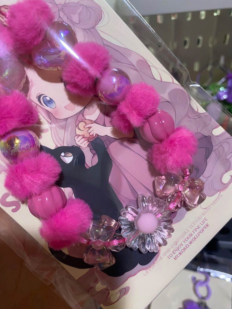 Cute Beaded Keychain with Pom Pom (Category: Charms) located in Tanauan. Submitted by mariacraftcorner (Listing ID 1465308144, Image 3). Description: - Adorable keychain featuring furry pom poms, shiny iridescent hearts, and flower charms - Includes a backing card with cute anime girl and black cat artwork - Available in 4 lovely colors: Black, Purple, Pink, and Light Blue - Price: ₱1,000 each - Take-all deal option available—message us for detai
