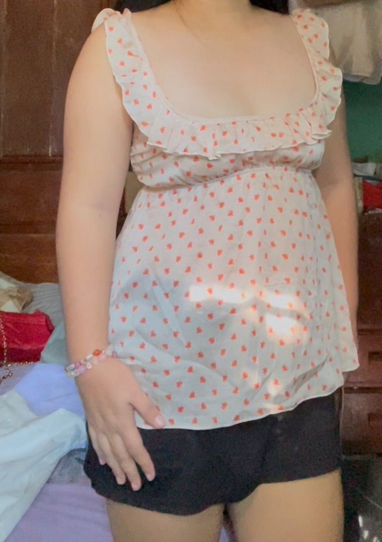 Cute floral ruffle strap top Cottage core cute top (Category: Sleeveless) located in Tuguegarao City. Submitted by dfchokee66196 (Listing ID 1465179420, Image 2). Description: - Design: Cream with all-over small red floral print - Details: Square neckline with ruffle trim and matching ruffled shoulder straps - Fit: Lightweight, breezy, and flattering empire waistline - Condition: Worn only once, practically brand new - Styling Tip: Pairs amazingl