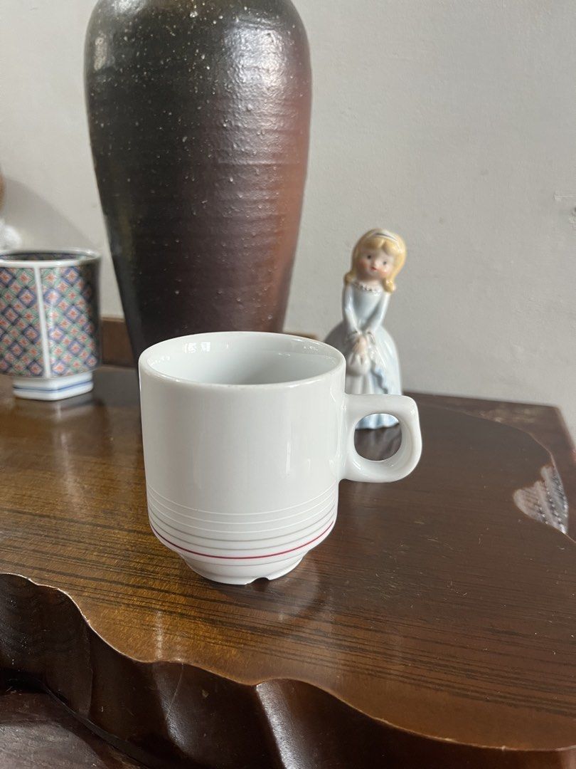 Czech Republic White Ceramic Mug with Red Stripe (Category: Coffee & Tea Tableware) located in Taguig. Submitted by minmin_parker (Listing ID 1465294324, Image 1). Description: - Material: White ceramic with grey and red horizontal stripes - Origin: Made in the Czech Republic - Dimensions: ~7 cm tall, ~7 cm top opening diameter - Features: Convenient side loop handle, dishwasher safe - Condition: Solid everyday mug, great for coffee or tea.