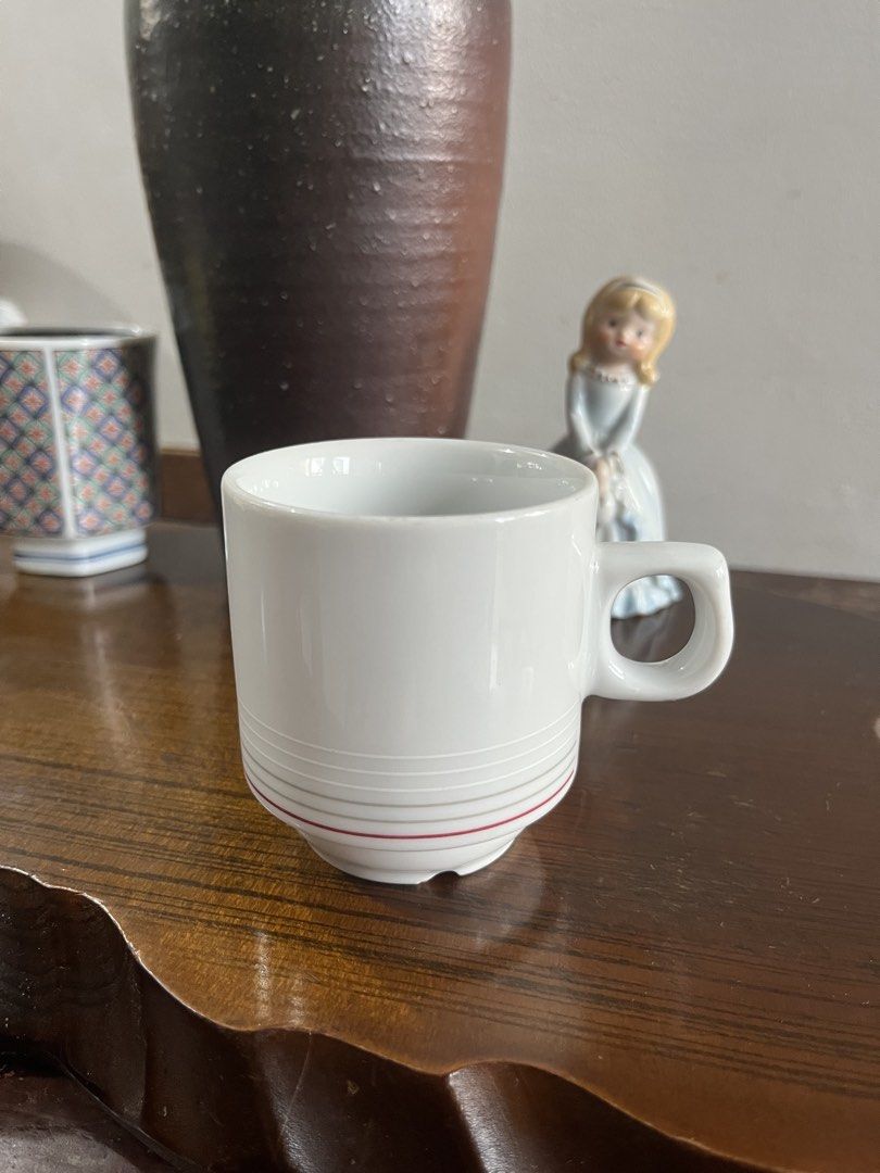 Czech Republic White Ceramic Mug with Red Stripe (Category: Coffee & Tea Tableware) located in Taguig. Submitted by minmin_parker (Listing ID 1465294324, Image 2). Description: - Material: White ceramic with grey and red horizontal stripes - Origin: Made in the Czech Republic - Dimensions: ~7 cm tall, ~7 cm top opening diameter - Features: Convenient side loop handle, dishwasher safe - Condition: Solid everyday mug, great for coffee or tea.