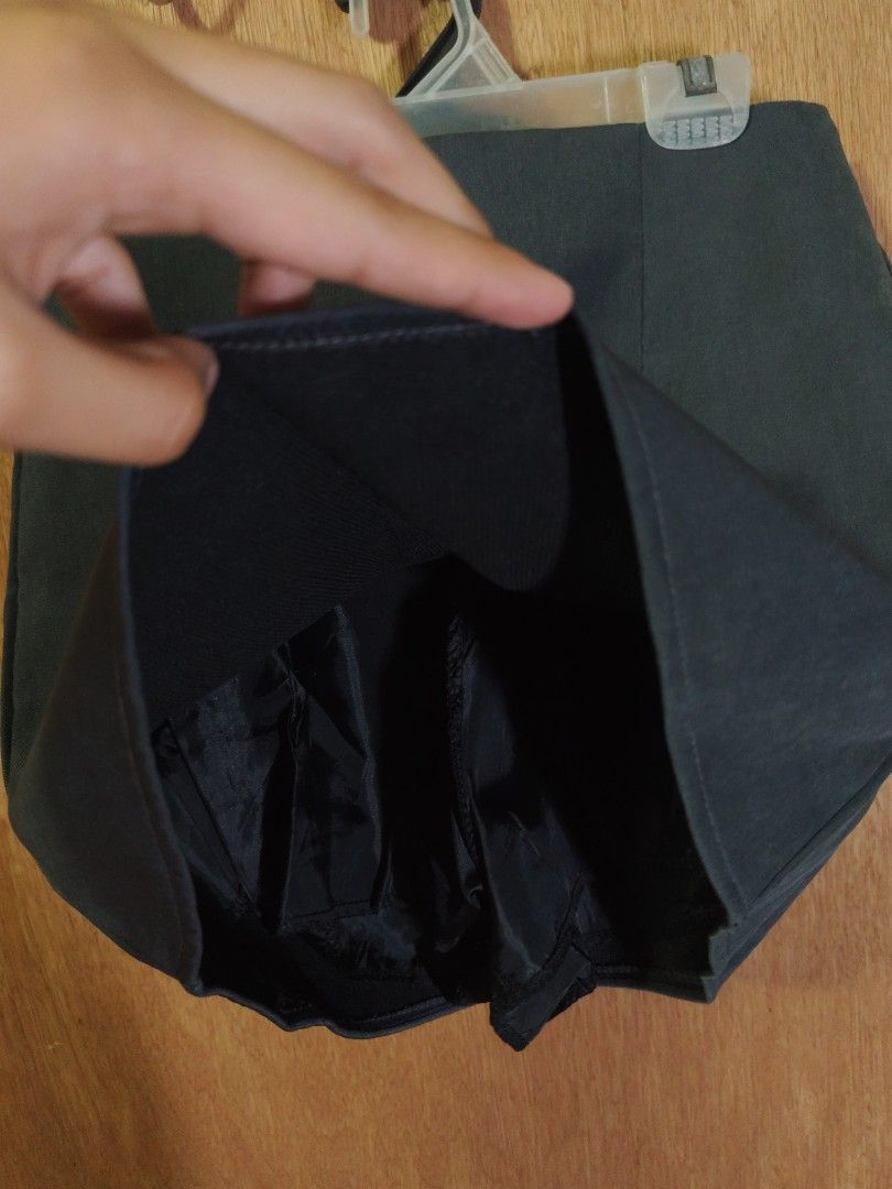 Dark Grey Skort with Inner Shorts (Category: Skirts) located in Caloocan City. Submitted by wisegem-c6c7 (Listing ID 1465232235, Image 2). Description: SIZE 24-25 - Color: Dark grey - Design: Mini skirt with built-in black shorts underneath for extra coverage - Waistband: Hidden elastic for a clean, comfortable fit - Fabric: Smooth and mid-weight - Style: Versatile solid color, perfect for everyday outfits.