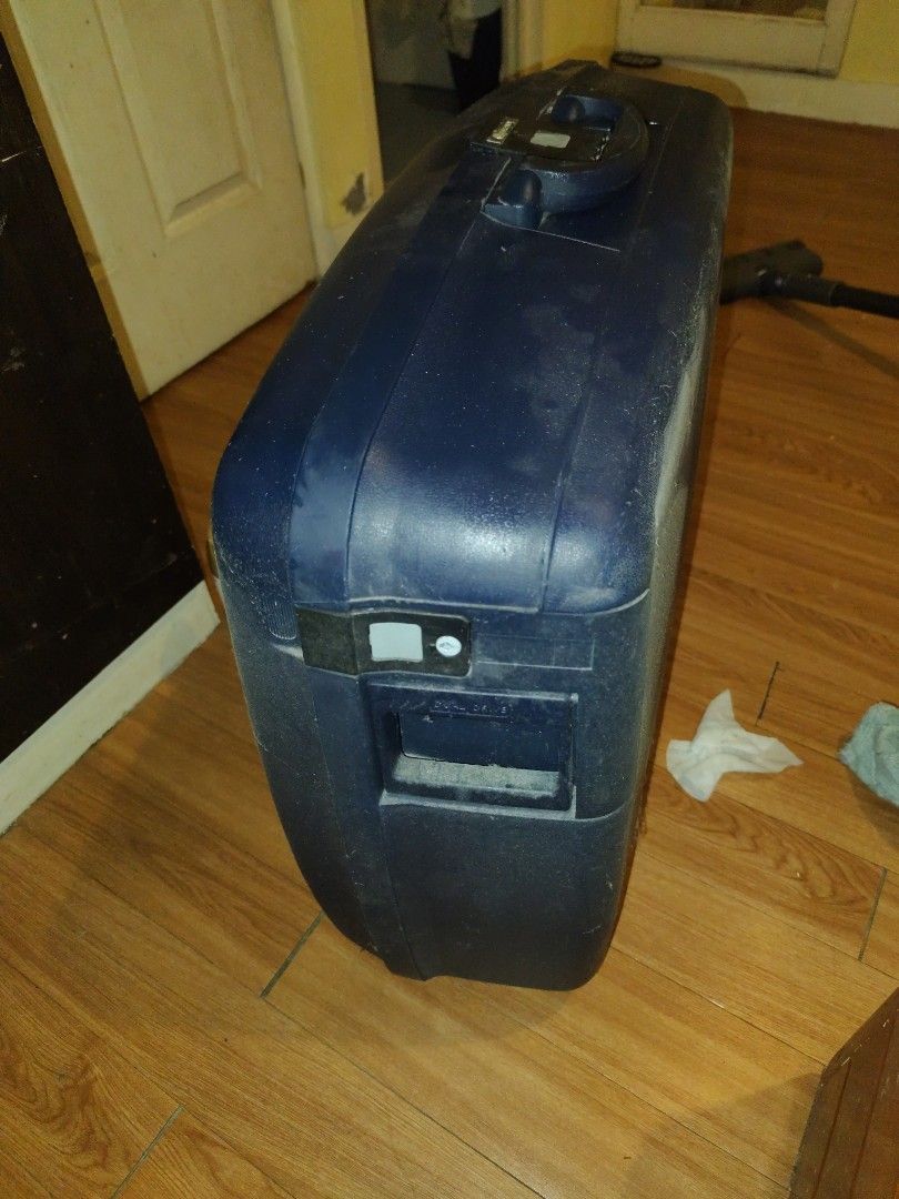Delsey Hard Shell Suitcase Blue (Category: Luggage) located in Manila. Submitted by silentstar-0f4b (Listing ID 1465282121, Image 3). Description: - Brand: Delsey - Color: Dark Blue - Material: Solid hard shell plastic - Security: Built-in combination lock next to the handle - Hardware: Heavy-duty handle and latch mechanism - Condition: Good overall, with minor dust and surface marks from storage - Size: Ideal for medium to long trips.