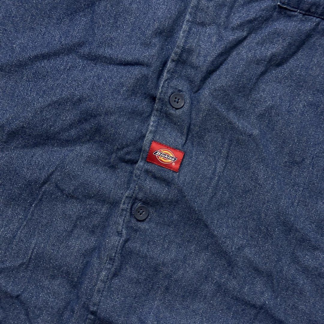Dickies denim short sleeve button up shirt (Category: Tshirts & Polo Shirts ) located in Manila. Submitted by johnedel_james (Listing ID 1465281535, Image 3). Description: - Brand: Dickies - Color: Classic Blue - Material: Durable Denim - Style: Short sleeve, button-down front - Details: Dual chest pockets, branded buttons, embroidered logo on pocket, and red logo tab near hem - Condition: Excellent / Pre-loved - Origin: Made in China - Perfect c
