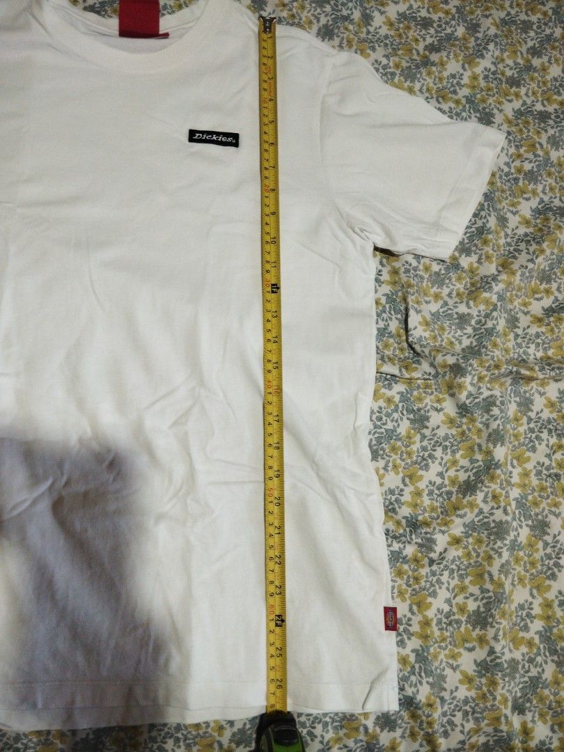 Dickies White T-Shirt Size L (Category: Tshirts & Polo Shirts ) located in Manila. Submitted by lene48 (Listing ID 1465254321, Image 3). Description: - Brand: Dickies - Color: White - Size: L - Material: 100% Cotton - Fit/Style: Standard crew neckline, short sleeves, classic basic tee - Details: Small woven logo on left chest, red neck tag branding - Condition/Vibe: Clean, versatile, and perfect for everyday wear.