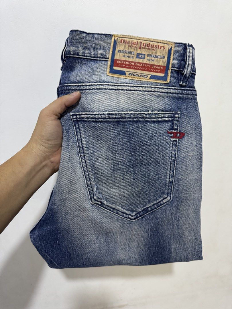 Diesel Industry Distressed Denim Jeans (Category: Jeans) located in Manila. Submitted by esparciake75752 (Listing ID 1465279651, Image 1). Description: Diesel Industry denim jeans in blue wash. Factory distressed details with whiskering and fading on the front and back. Classic five-pocket styling with coin pocket logo patch and back pocket embroidery. Branded leather back patch at the waistband. Metal button fly closure..