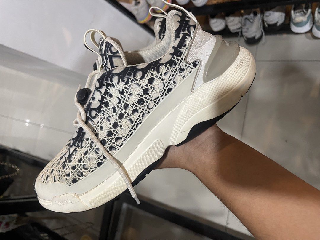 Dior B22 Sneaker Black White Oblique Mesh (Category: Sneakers) located in Cavite. Submitted by thriftkicks3 (Listing ID 1465282550, Image 3). Description: - Brand: Dior B22 - Colorway: Classic Black and White Oblique Print - Size: EU 42 - Design: Chunky rubber sole, mesh and technical fabric upper, cord lacing system - Branding: Embossed 'CHRISTIAN DIOR' on heel and 'DIOR' on toe - Condition: Minor signs of wear on midsoles and laces.