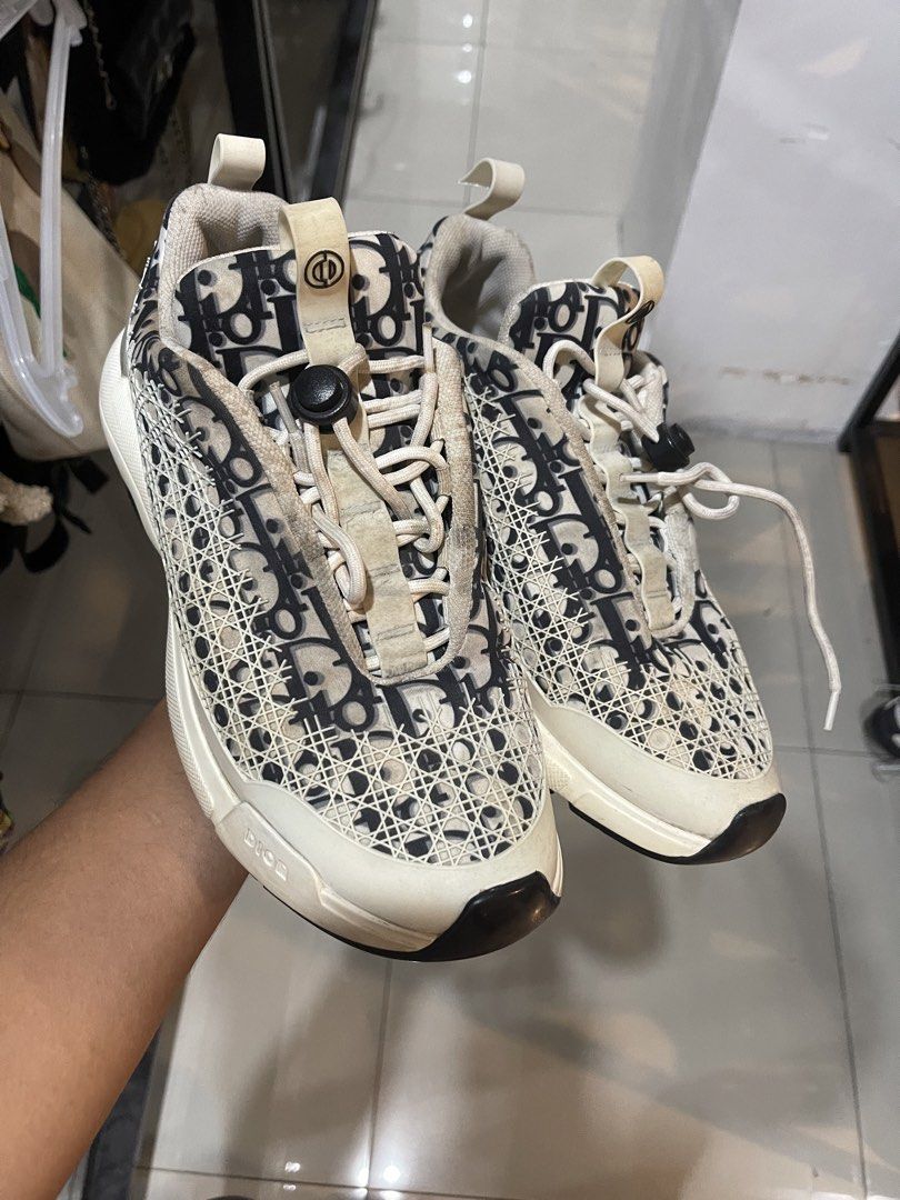 Dior B22 Sneaker Black White Oblique Mesh (Category: Sneakers) located in Cavite. Submitted by thriftkicks3 (Listing ID 1465282550, Image 2). Description: - Brand: Dior B22 - Colorway: Classic Black and White Oblique Print - Size: EU 42 - Design: Chunky rubber sole, mesh and technical fabric upper, cord lacing system - Branding: Embossed 'CHRISTIAN DIOR' on heel and 'DIOR' on toe - Condition: Minor signs of wear on midsoles and laces.