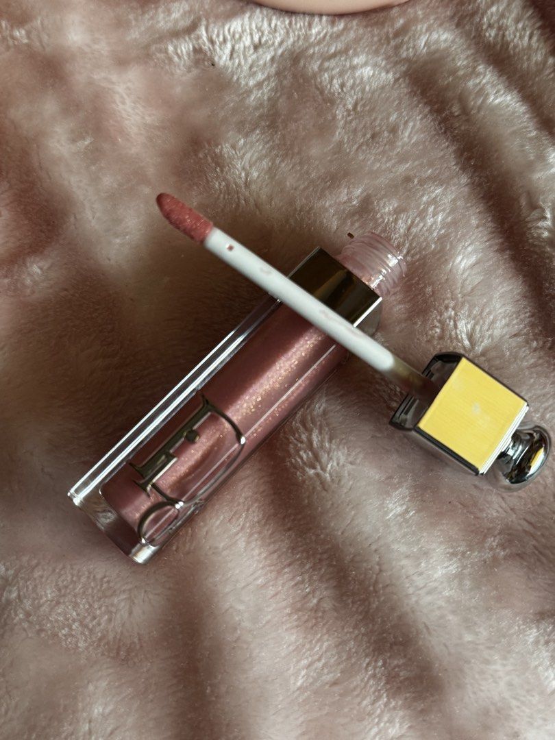 Dior lip maximized (Category: Makeup) located in Manila. Submitted by emilyclothes.usa (Listing ID 1465172687, Image 1). Description: Dior Lip Maximizer 💗 * Authentic Dior lip gloss/lip plumper * Beautiful pink rosy shade with subtle shimmer * Gives lips a glossy, plump-looking finish * Comes with the original Dior packaging * Gently used, still has plenty of product * Good condition, no major damage * Perfect for everyday makeup or going out.