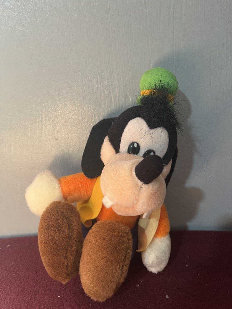 Disney Goofy Stuffed Plush Toy (Category: Plushies & Soft Toys) located in Baguio. Submitted by gaara1234 (Listing ID 1465195881, Image 1). Description: - Authentic classic Disney Goofy plush toy in a cute sitting pose - Wears his signature outfit: orange shirt, blue pants, yellow vest, and green hat - Detailed with fuzzy black hair, white fabric teeth, big brown feet, and white-gloved hands - Super soft and huggable plush material - Perfect for 