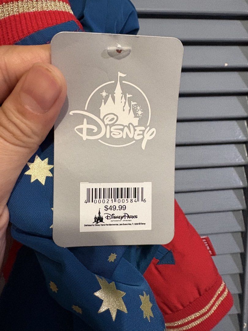Disney Parks Captain Marvel Bomber Jacket Size 5/6 (Category: Babies & Kids Fashion) located in Quezon City. Submitted by pjr15 (Listing ID 1465210310, Image 2). Description: - Authentic Disney Parks Captain Marvel bomber jacket - Size: 5/6 (fits up to 116 cm height) - Design: Red body with blue sleeves and all-over gold star prints - Details: Large embroidered star patches on front and back, gold star zipper pull, and metallic gold-striped ribbe