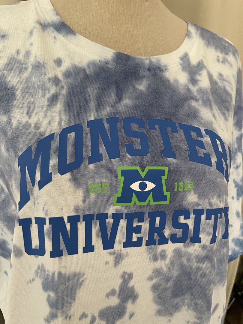 Disney Pixar MU MERCH (Category: Tshirts & Polo Shirts ) located in Cainta. Submitted by zlove111 (Listing ID 1465171925, Image 2). Description: - Authentic Disney Pixar Monsters University graphic t-shirt - Cool blue and white all-over tie-dye wash - Fun collegiate-style front print - Classic crew neck and short sleeves - Size: up to 2xl 24" - Condition: Brand new with tags attached.