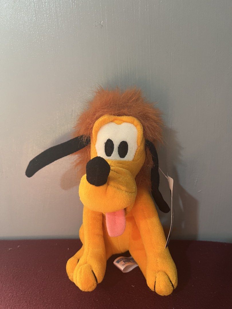 Disney Pluto with Hair Mane Plush Toy (Category: Plushies & Soft Toys) located in Baguio. Submitted by gaara1234 (Listing ID 1465195893, Image 1). Description: - Features a unique fuzzy hair mane, bright orange fur, and floppy black ears - Includes original tag near the ear and a rare error tag on the bottom foot - Super soft and cuddly, ideal for Disney fans and plushie collectors - Ships fast and securely from a trusted seller.