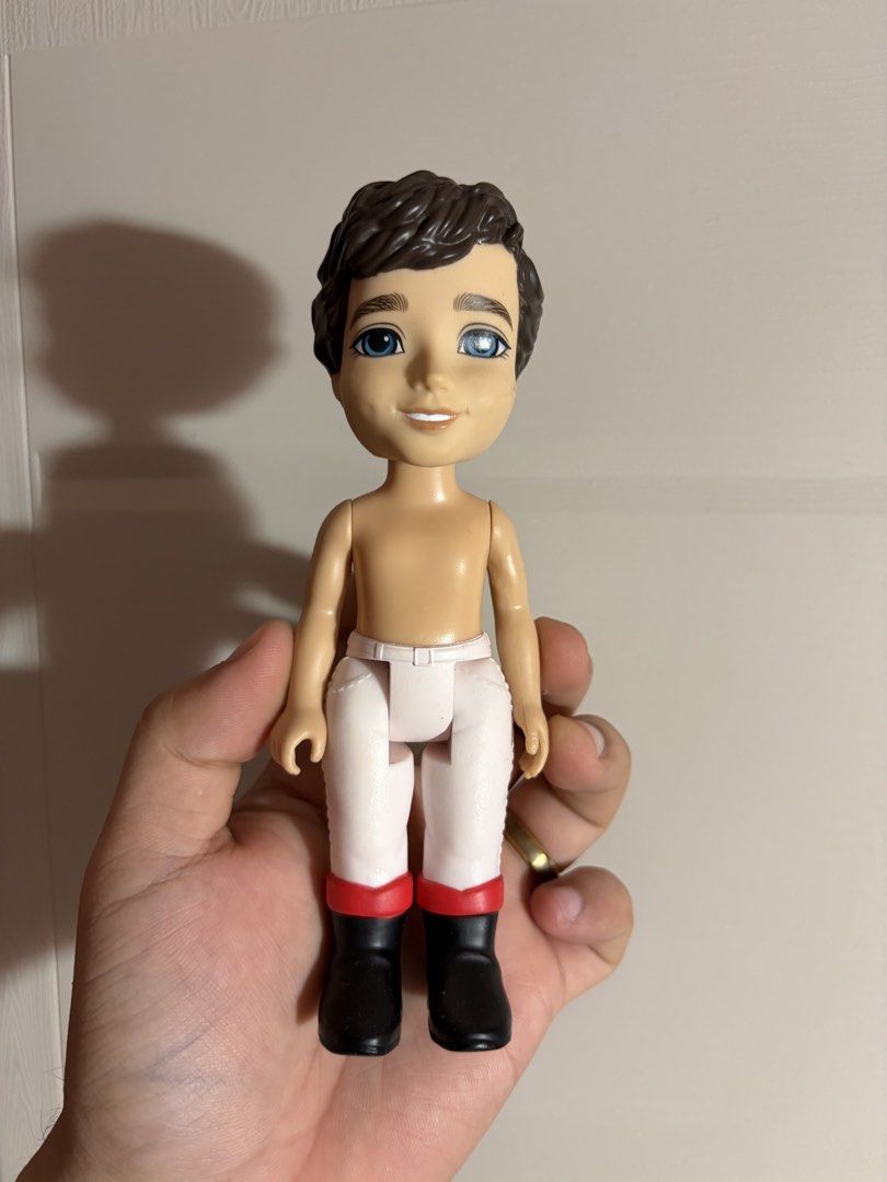 Disney’s Prince Eric Doll (Category: Figurines & Statues) located in Plaridel. Submitted by moddedjarvis (Listing ID 1465172219, Image 1). Description: - Brand/Maker: Disney by JAKKS Pacific - Appearance: Molded short brown hair, blue eyes, shirtless body - Outfit: Includes white pants and black boots with red trim (original shirt missing) - Condition: Loose figure, clean plastic limbs, and decent face paint - Authenticity: Back stamp includes Di