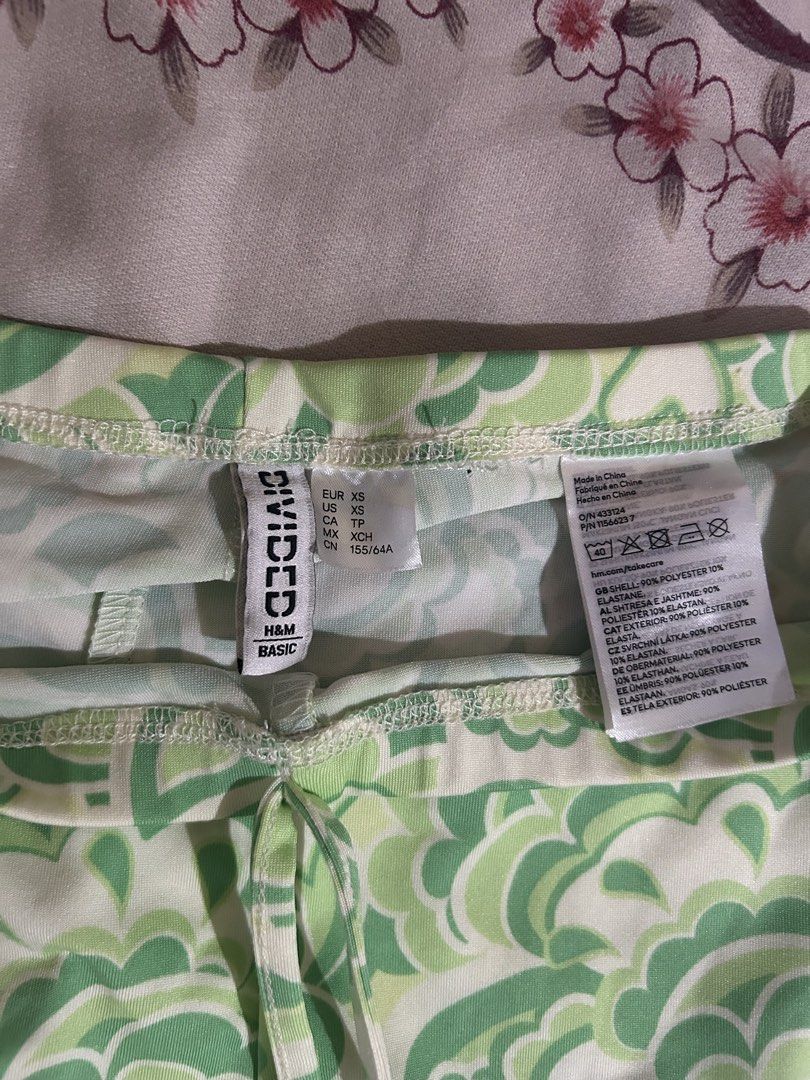Divided H&M Patterned Flared Trousers (Category: Jeans) located in Mandaluyong City. Submitted by mariamadeline (Listing ID 1465343317, Image 2). Description: - Brand/Style: Divided by H&M green and white patterned flared trousers - Size: XS - Flaws: A few slightly noticeable brownish stains near the front waistline and upper leg area (please check all photos closely) - Never been used but stains might somehow be removed by washing.