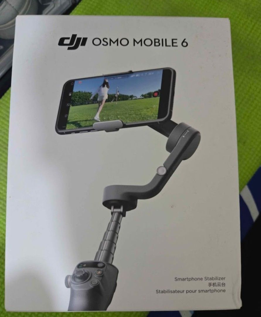 DJI Osmo Mobile 6 Smartphone Stabilizer (Category: Gimbals & Stabilizers ) located in Pasig City. Submitted by kai_2107 (Listing ID 1465375012, Image 1). Description: - Item: DJI Osmo Mobile 6 Smartphone Gimbal Stabilizer - Condition: Brand new, unopened plastic wrapping still intact on the main unit and handle - Inclusions: Complete with retail box, charging cable, storage pouch, and a neck strap with an extra mounting ring - Perfect for vloggin
