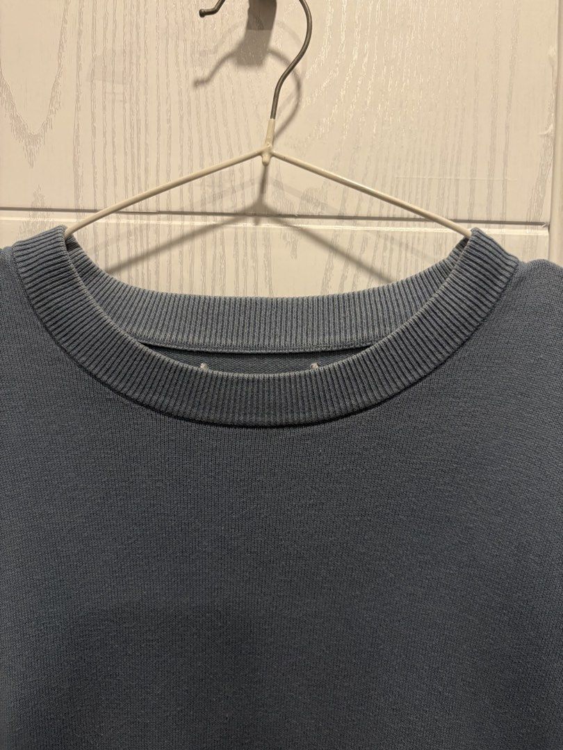 DNWR Light Blue Knit Sweater (Category: Sleep and Loungewear) located in Mandaluyong City. Submitted by shopwithjuu (Listing ID 1465284068, Image 3). Description: DNWC light blue knit sweater in a relaxed, oversized fit. Made from a soft, comfortable cotton blend with a crew neck and a small embroidered logo. Clean and ready to wear!.