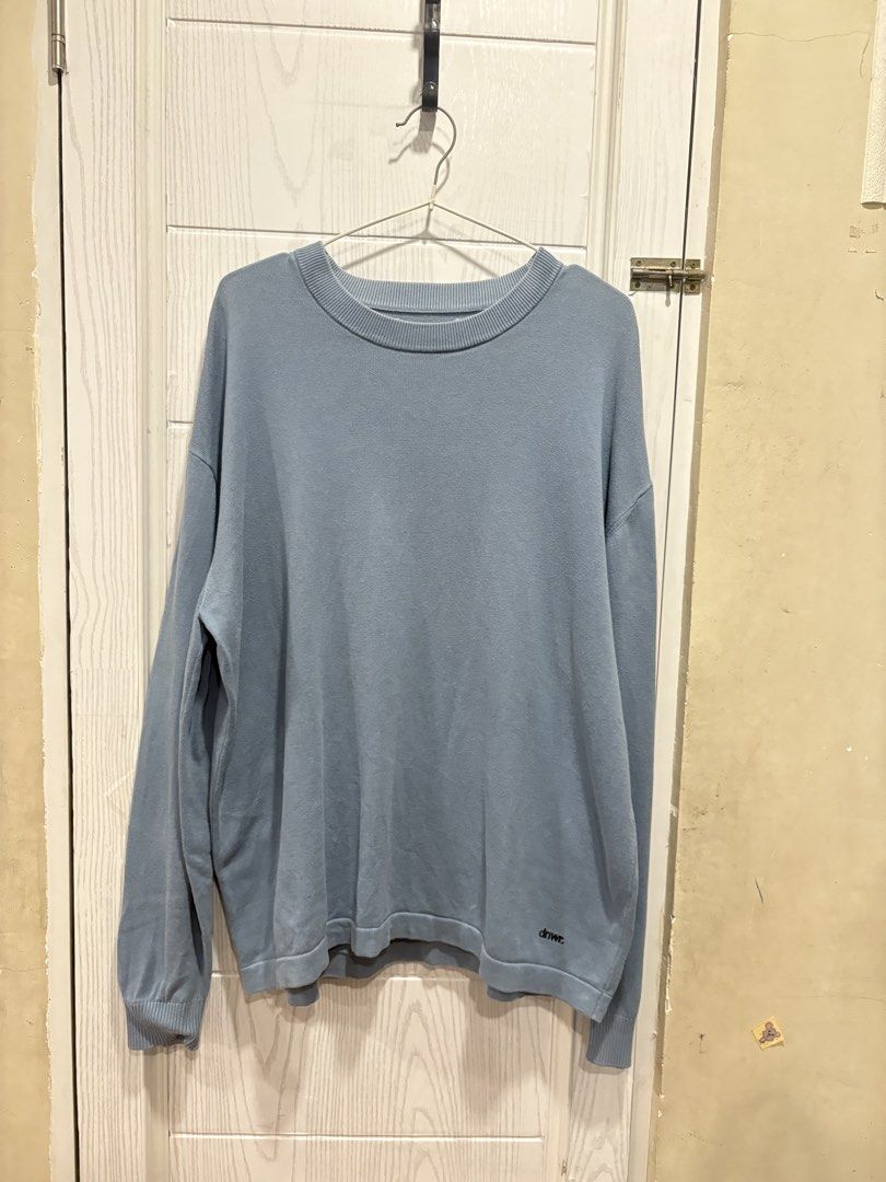 DNWR Light Blue Knit Sweater (Category: Sleep and Loungewear) located in Mandaluyong City. Submitted by shopwithjuu (Listing ID 1465284068, Image 1). Description: DNWC light blue knit sweater in a relaxed, oversized fit. Made from a soft, comfortable cotton blend with a crew neck and a small embroidered logo. Clean and ready to wear!.