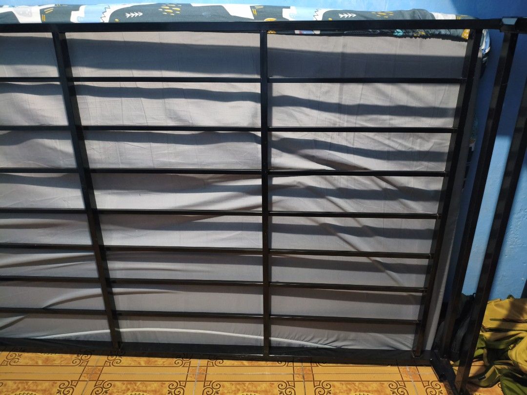 Double Bed Frame with Single Pull-Out Bed Frame (Category: Bed Frames & Mattresses) located in Pasig City. Submitted by hello_vvorld (Listing ID 1465326625, Image 2). Description: Hello! I'm selling this double-sized bed frame with a single-sized pull-out bed frame from CarbonSteel for only ₱3,499. I’m selling it because I recently moved to a place with a loft bed, and the frame makes the bedroom feel a bit cramped. I bought this bed frame in Dec