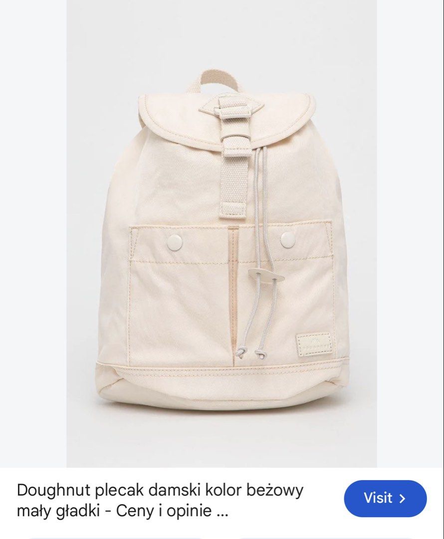 Doughnut beige mini backpack (Category: Backpacks) located in Manila. Submitted by esparciake75752 (Listing ID 1465305226, Image 1). Description: - Brand: Doughnut - Color: Beige - Closure: Drawstring under main flap with front snap pockets - Straps: Adjustable shoulder straps and convenient top carry handle - Condition: Clean fabric exterior with signature brand patch - Usage: Compact size, ideal for daily commutes or quick trips.