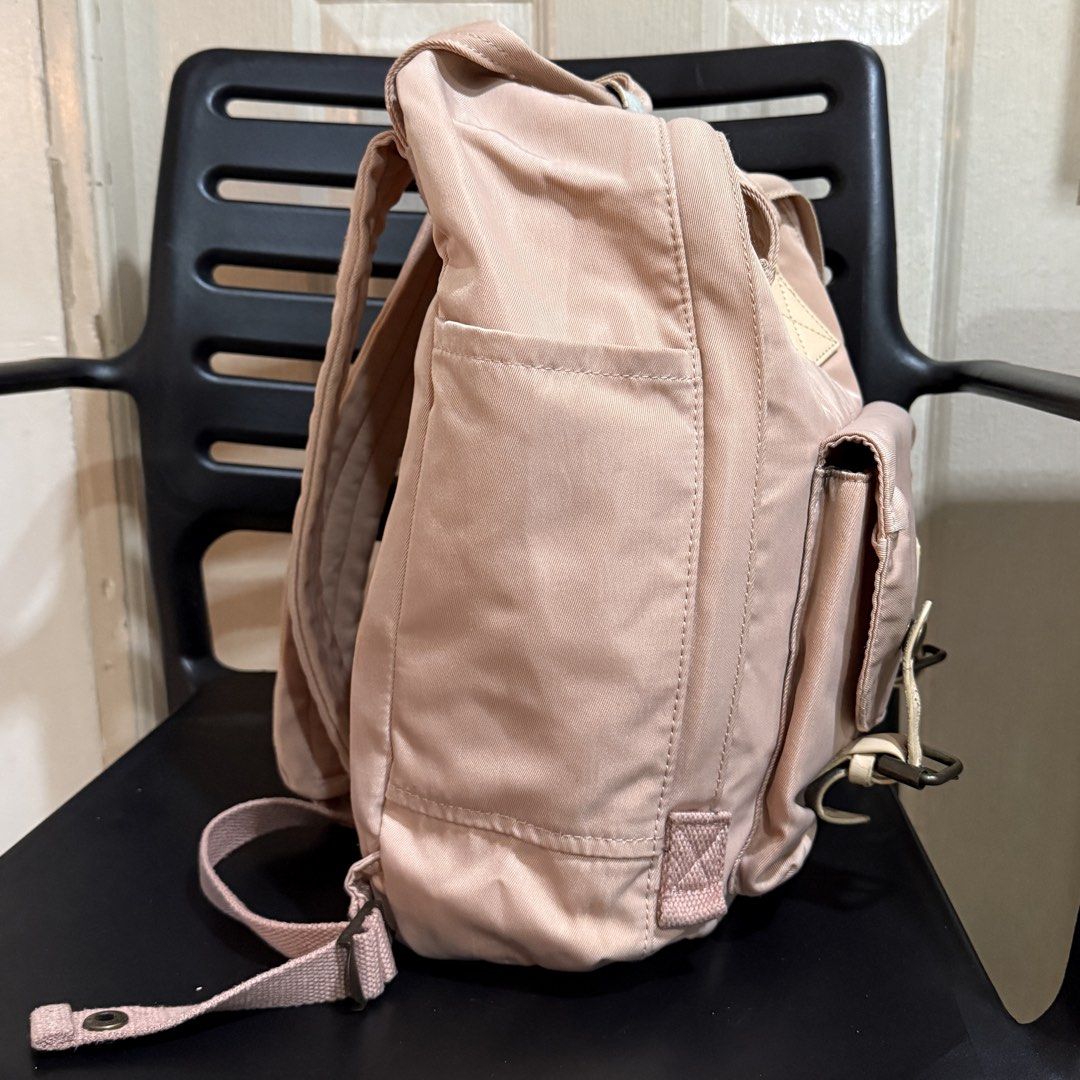 Doughnut Macaroon Backpack Pink (Category: Backpacks) located in Makati City. Submitted by julyco. (Listing ID 1465357435, Image 2). Description: - Brand/Model: Doughnut Macaroon Backpack - Color: Dusty Pink with Cream Leather Accents - Material: Durable Nylon Fabric with Metal Hardware - Storage: Main dual-zipper closure, front zipped compartment, and side pockets - Features: Top carrying handles with snap button tab and adjustable back straps -