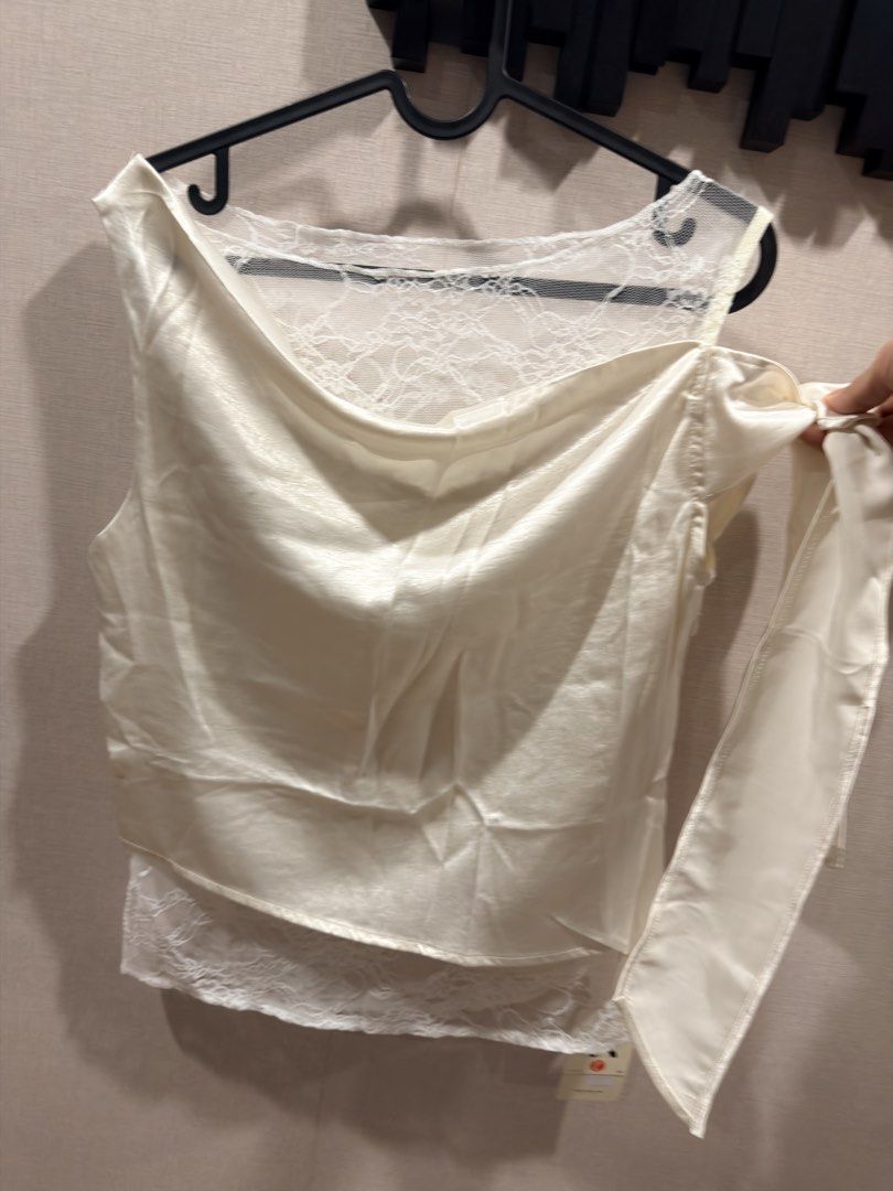 Drape Silky Lace top, FS (Category: Others Tops) located in Pasig City. Submitted by theclosetcasemanila (Listing ID 1465339501, Image 3). Description: Brand new Silky material with lace accent inner Drape neck Asymmetrical shoulder with tie Bust fits upto 36”.