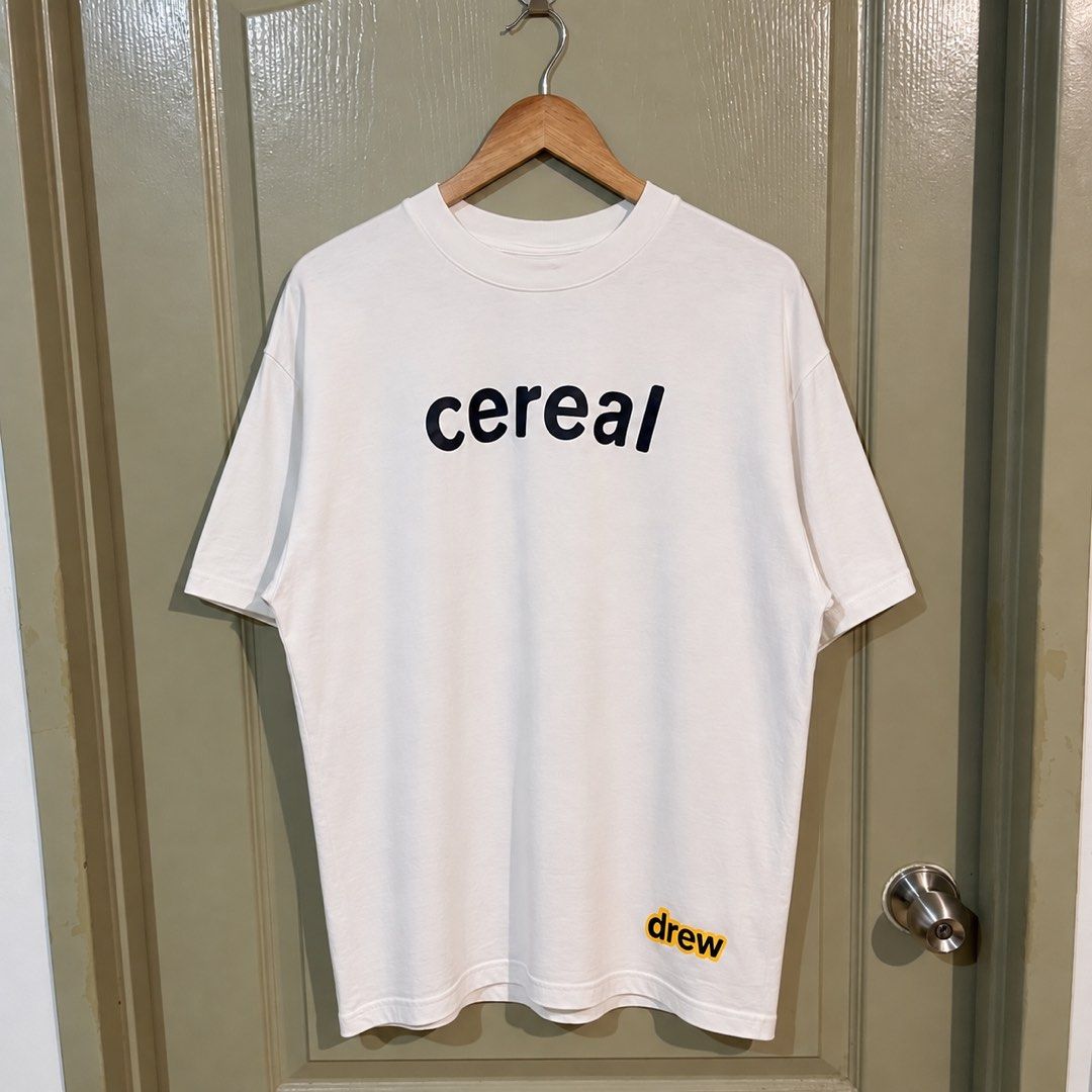 Drew “Cereal” Tee (Category: Tshirts & Polo Shirts ) located in Makati City. Submitted by gustavoo28 (Listing ID 1465355900, Image 1). Description: Authentic/Legit No issues 10/10 color rate Excellent Condition 23W 29L in inches Check photos for reference.