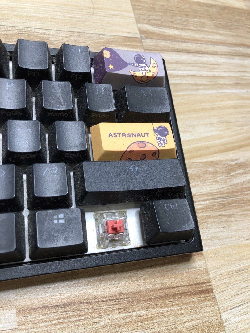 Ducky One 2 Mini - V1 (Category: Computer Keyboard) located in Manila. Submitted by jshmnl (Listing ID 1465359833, Image 2). Description: —60% — Not wireless/Cable not included — Switches: Cherry MX switches - Keycaps: Astronaut 2.0 custom keycaps with purple and black accents, plus novelty caps and special spacebar - Condition: Fully functional with visible dust buildup between keys from storage/use, ready for a quick clean - Honest issue — Lost