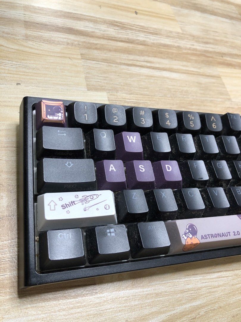 Ducky One 2 Mini - V1 (Category: Computer Keyboard) located in Manila. Submitted by jshmnl (Listing ID 1465359833, Image 3). Description: —60% — Not wireless/Cable not included — Switches: Cherry MX switches - Keycaps: Astronaut 2.0 custom keycaps with purple and black accents, plus novelty caps and special spacebar - Condition: Fully functional with visible dust buildup between keys from storage/use, ready for a quick clean - Honest issue — Lost