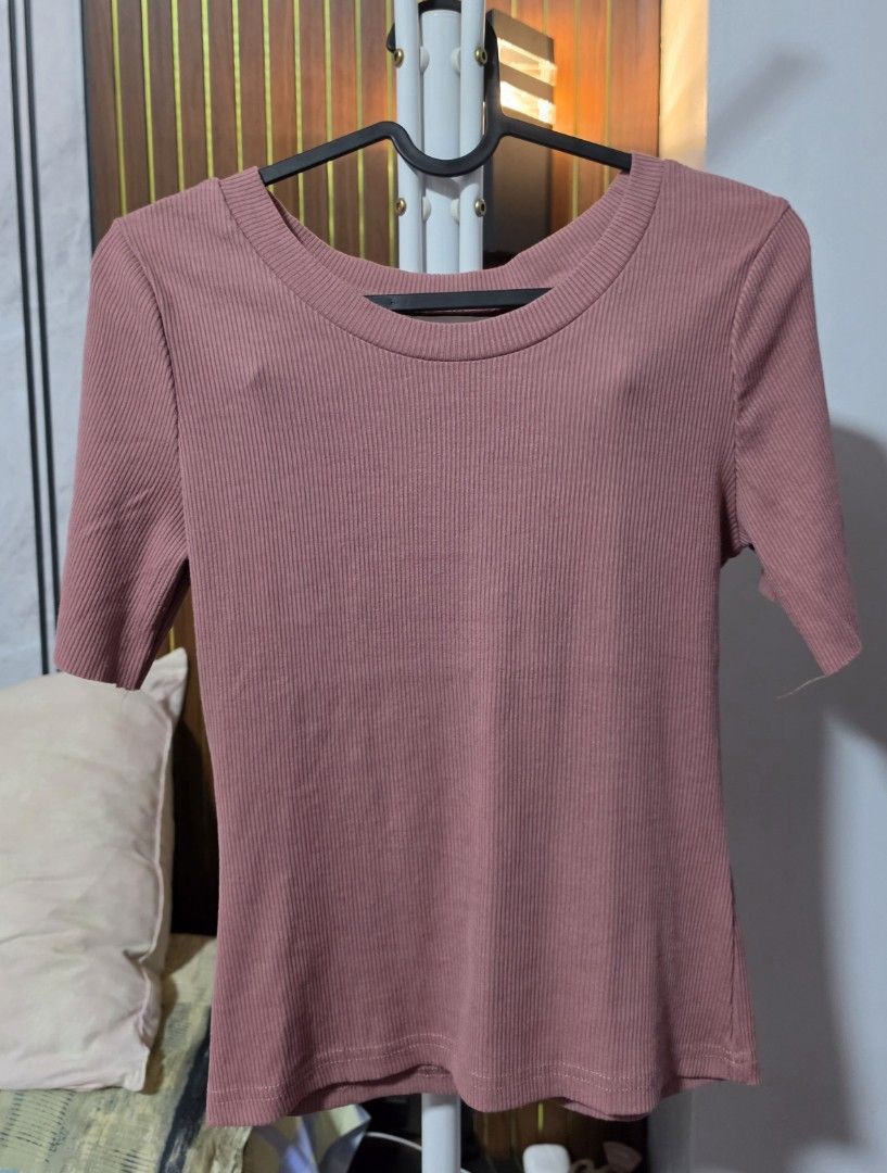 Dusty Pink Ribbed Short Sleeve Top (Category: Blouses) located in Paranaque City. Submitted by franinnashop (Listing ID 1465310696, Image 3). Description: DECLUTTER SMALL TO MED PARANAQUE CITY - Color: Dusty pink - Fabric: Soft, stretchy ribbed knit - Design: Round neckline, short sleeves, fitted silhouette - Versatility: Easy to pair with jeans, skirts, or shorts - Occasion: Perfect for everyday casual wear.