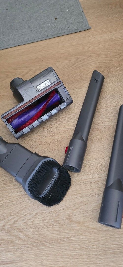 Dyson Vacuum Cleaner Attachments and Motorbar (Category: Vacuum Cleaner & Housekeeping) located in Manila. Submitted by vi_ka (Listing ID 1465310529, Image 2). Description: - Genuine Dyson vacuum replacement parts bundle - Includes: Motorized hair screw tool (purple brush bar), combination brush tool, and 2 crevice tools - Compatible with various cordless Dyson models - Perfect if you lost or need to replace your original attachments.